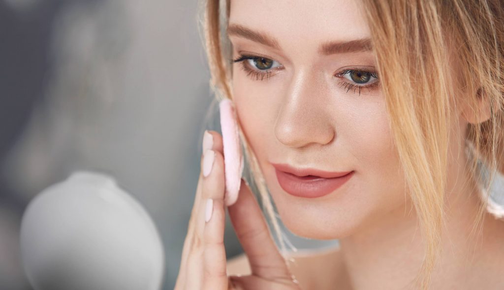 A close up of a woman brushing her hair