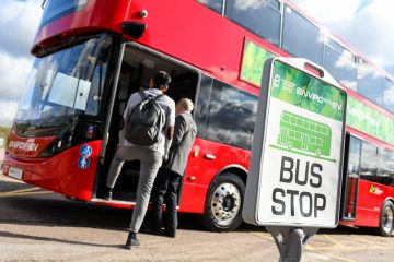 A double decker bus parked on the side of a road