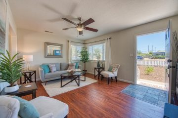 A living room filled with furniture and a large window